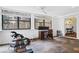 Well-lit exercise room with windows, golf clubs and an exercise machine at 52 Chaumont Nw Sq, Atlanta, GA 30327