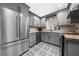Bright kitchen with stainless steel appliances, gray cabinets, and stylish patterned tile flooring at 52 Chaumont Nw Sq, Atlanta, GA 30327