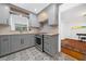 Stylish kitchen featuring gray cabinets, light wood countertops, and stainless steel appliances at 52 Chaumont Nw Sq, Atlanta, GA 30327