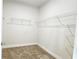 This walk-in closet is ready for storage with its sturdy, white-wire shelving at 621 Pineberry Ct, Grayson, GA 30017