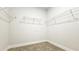 This walk-in closet is ready for immediate use with its sturdy white-wire shelving at 621 Pineberry Ct, Grayson, GA 30017
