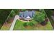 Stunning bird's-eye view of home nestled within a lush landscape featuring verdant lawn at 1253 Oakwood Pl, Loganville, GA 30052