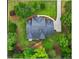 Overhead aerial view of the home's roof, yard, driveway, and surrounding greenery at 1253 Oakwood Pl, Loganville, GA 30052