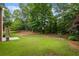 Expansive backyard featuring lush greenery, perfect for outdoor activities and gatherings at 1253 Oakwood Pl, Loganville, GA 30052