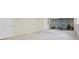 Partially finished basement with garage door and a white door at 1253 Oakwood Pl, Loganville, GA 30052
