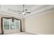 Bedroom featuring a ceiling fan and large windows at 1253 Oakwood Pl, Loganville, GA 30052