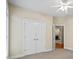 Bedroom with closet and view of the rest of the home through an open door at 1253 Oakwood Pl, Loganville, GA 30052