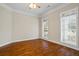 Bright bedroom with hardwood floors, neutral walls, and large windows at 1253 Oakwood Pl, Loganville, GA 30052