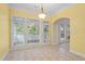 Bright eat-in kitchen area featuring tile floors and a wall of windows at 1253 Oakwood Pl, Loganville, GA 30052