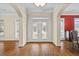 Elegant entryway featuring hardwood floors and a white framed decorative glass front door at 1253 Oakwood Pl, Loganville, GA 30052
