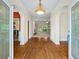 Inviting entryway with hardwood floors, arched doorways, and decorative lighting at 1253 Oakwood Pl, Loganville, GA 30052