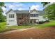 Rear exterior showing the two-story deck, attached garage and spacious backyard at 1253 Oakwood Pl, Loganville, GA 30052