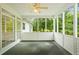 Comfortable screened porch featuring carpet, neutral decor, and providing outdoor views at 1253 Oakwood Pl, Loganville, GA 30052