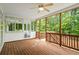 Inviting screened porch offering natural light, wood floors, and access to the backyard at 1253 Oakwood Pl, Loganville, GA 30052