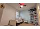 bedroom features a ceiling fan, natural light, and fun decor at 13030 Crabapple Lake Dr, Roswell, GA 30076