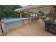 Relaxing community gazebo with ceiling fans overlooking the tennis courts, providing a comfortable social gathering space at 13030 Crabapple Lake Dr, Roswell, GA 30076