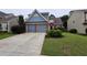 Charming two-story home featuring a well-manicured lawn, a two-car garage, and attractive curb appeal at 13030 Crabapple Lake Dr, Roswell, GA 30076