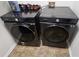 Laundry room with modern front-load washer and dryer at 13030 Crabapple Lake Dr, Roswell, GA 30076