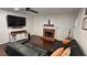Comfortable living room features a fireplace and a large television for cozy evenings at 13030 Crabapple Lake Dr, Roswell, GA 30076