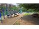 Community playground featuring slides, climbing structures, and a picnic table, perfect for outdoor Gathering fun at 13030 Crabapple Lake Dr, Roswell, GA 30076