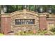 Stone sign with brick pillars reads 'Crabapple Lake', highlighting the neighborhood at 13030 Crabapple Lake Dr, Roswell, GA 30076