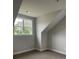 Cozy bedroom with carpet, sloped ceiling, and a bright window at 2021 Shallowford Rd, Marietta, GA 30066