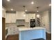 Modern kitchen featuring white cabinetry, stainless steel appliances, and a large center island at 2021 Shallowford Rd, Marietta, GA 30066