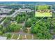 A brick home and surrounding green spaces from above at 519 Beaver Ruin Nw Way, Lilburn, GA 30047