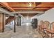 Unfinished basement with exposed ceiling, concrete floor, and stairs leading to the upper level at 519 Beaver Ruin Nw Way, Lilburn, GA 30047