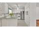 Well-lit kitchen with updated white cabinets and stainless steel appliances, offering ample counter space at 519 Beaver Ruin Nw Way, Lilburn, GA 30047