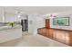 Inviting living area with stainless steel appliances, refinished hardwood floors, and ample natural light at 519 Beaver Ruin Nw Way, Lilburn, GA 30047