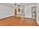 Spacious living room features hardwood floors and a neutral color scheme, flowing into the kitchen at 519 Beaver Ruin Nw Way, Lilburn, GA 30047