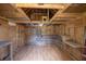 Empty interior of an outbuilding with wood walls and shelves, offering ample storage space at 519 Beaver Ruin Nw Way, Lilburn, GA 30047