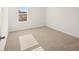 Bright bedroom featuring neutral carpet and a window at 1473 Autumn Wind Dr, Dacula, GA 30019