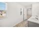 Bathroom featuring double sinks and a modern vanity with views of the neighborhood at 1483 Autumn Wind Dr, Dacula, GA 30019