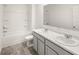 Bathroom featuring double sinks, a tub, and modern fixtures at 1483 Autumn Wind Dr, Dacula, GA 30019