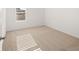 Bright bedroom with a window, neutral carpet, and white walls at 1483 Autumn Wind Dr, Dacula, GA 30019