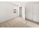 Bedroom featuring a closet, bright window, and neutral carpeting at 1483 Autumn Wind Dr, Dacula, GA 30019