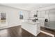 Modern kitchen featuring granite countertops, stainless steel appliances, and a large center island at 1483 Autumn Wind Dr, Dacula, GA 30019