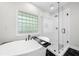 Luxurious bathroom featuring a glass shower, standalone tub, and sleek fixtures for a spa-like retreat at 2324 Oakview Ne Rd, Atlanta, GA 30317