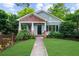 Charming home with a well-manicured lawn and covered porch, situated behind a cute fence at 2324 Oakview Ne Rd, Atlanta, GA 30317