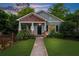 Charming home with a well-manicured lawn, covered porch, and attractive curb appeal at 2324 Oakview Ne Rd, Atlanta, GA 30317