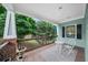 Inviting front porch with seating area and a view of the lush surroundings at 2324 Oakview Ne Rd, Atlanta, GA 30317