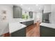 Modern kitchen with stainless steel appliances, white countertops, and ample cabinet space at 2324 Oakview Ne Rd, Atlanta, GA 30317