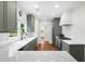 Well-lit kitchen with stainless steel appliances, granite countertop and tile backsplash at 2324 Oakview Ne Rd, Atlanta, GA 30317