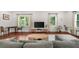 Bright living room with hardwood floors, modern furniture, and large windows for ample natural light at 2324 Oakview Ne Rd, Atlanta, GA 30317