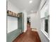 Hallway with a built in mudroom area and hooks for storage near a window with natural light at 2324 Oakview Ne Rd, Atlanta, GA 30317