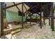 Open patio space with stone flooring, wooden support beams and an outdoor seating area at 2324 Oakview Ne Rd, Atlanta, GA 30317