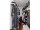 Organized walk-in closet with ample shelving and hanging space for effortless storage at 2324 Oakview Ne Rd, Atlanta, GA 30317