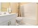 Bathroom featuring a combined toilet, vanity, and shower-tub combo with a curtain at 2451 Broad River Pl, Ellenwood, GA 30294
